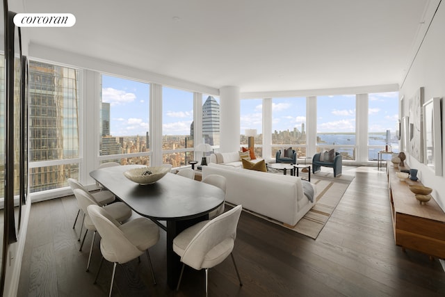 35 Hudson Yards Unit 7403, New York City, NY 10001 - dining area with expansive windows, wood finished floors, and a view of city