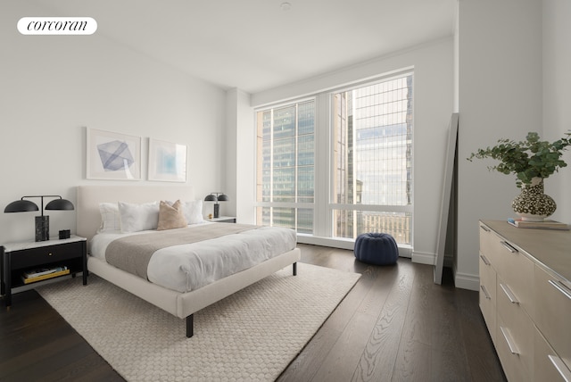 35 Hudson Yards Unit 7403, New York City, NY 10001 - bedroom featuring dark wood-style floors and baseboards