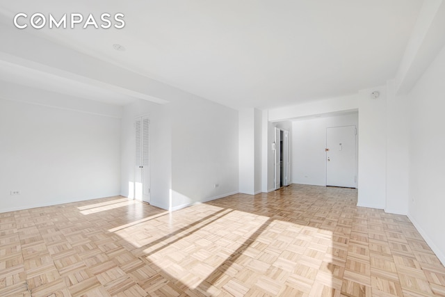 empty room with baseboards