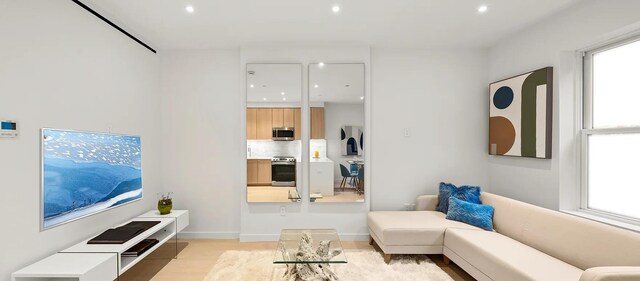 34 E 126th St Unit Ph-3, New York City, NY 10035 - living area with light wood-style floors and recessed lighting
