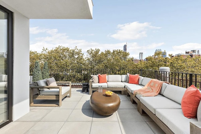 balcony with outdoor lounge area and a view of city