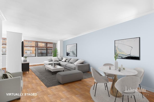 living room featuring crown molding and baseboards