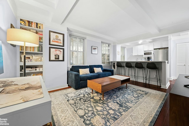 155 E 49th St Unit 1A, New York City, NY 10017 - living area with beam ceiling and dark wood-style floors