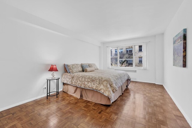 415 E 52nd St Unit 3Aa, New York City, NY 10022 - bedroom with radiator and baseboards