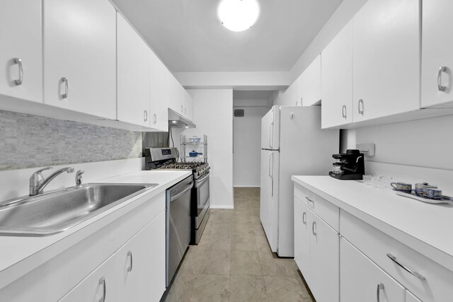 415 E 52nd St Unit 3Aa, New York City, NY 10022 - kitchen with a sink, under cabinet range hood, appliances with stainless steel finishes, and light countertops