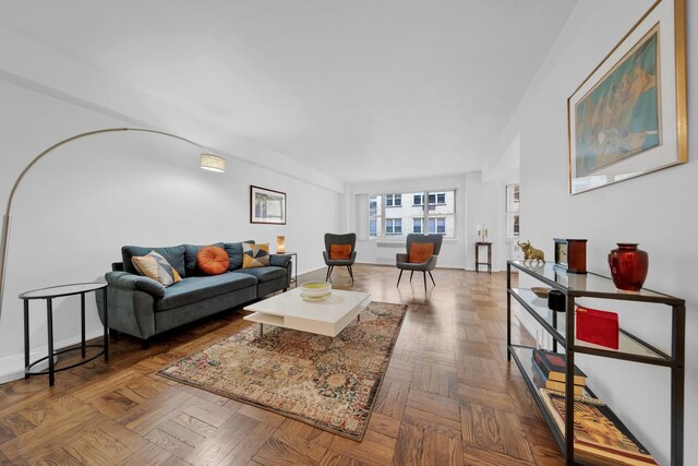 415 E 52nd St Unit 3Aa, New York City, NY 10022 - living room featuring radiator and baseboards