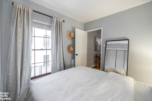 bedroom featuring a baseboard heating unit