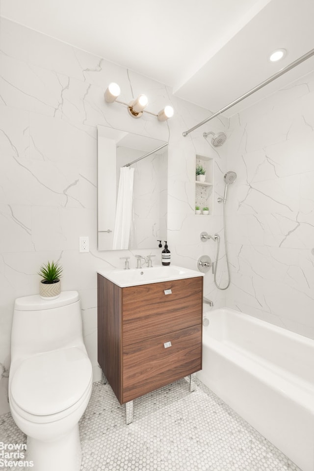bathroom with tile patterned floors, toilet, tile walls, shower / bath combo with shower curtain, and vanity