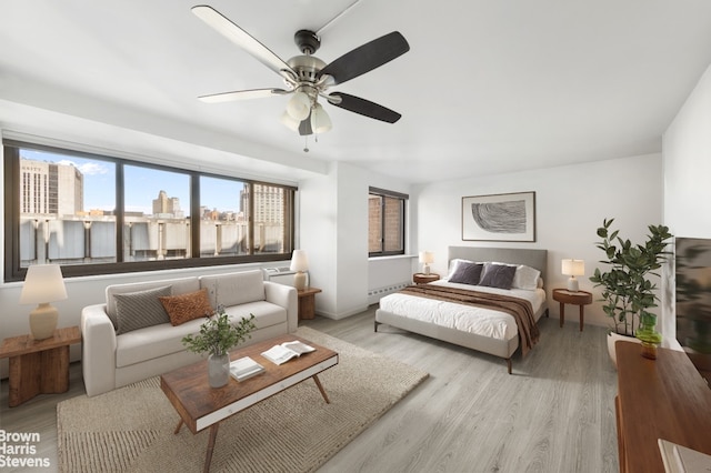 333 Pearl St Unit 14G, New York City, NY 10038 - bedroom with light wood-type flooring and a ceiling fan