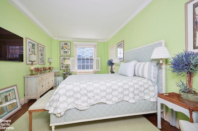 bedroom featuring ornamental molding and dark wood-style floors