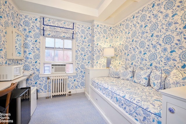 bedroom with light colored carpet, wallpapered walls, radiator heating unit, and baseboards