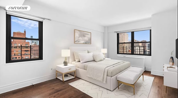 bedroom with baseboards, a city view, and dark wood-type flooring