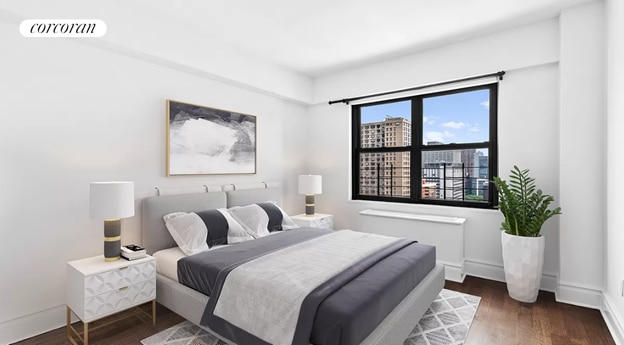 bedroom featuring baseboards, visible vents, and wood finished floors