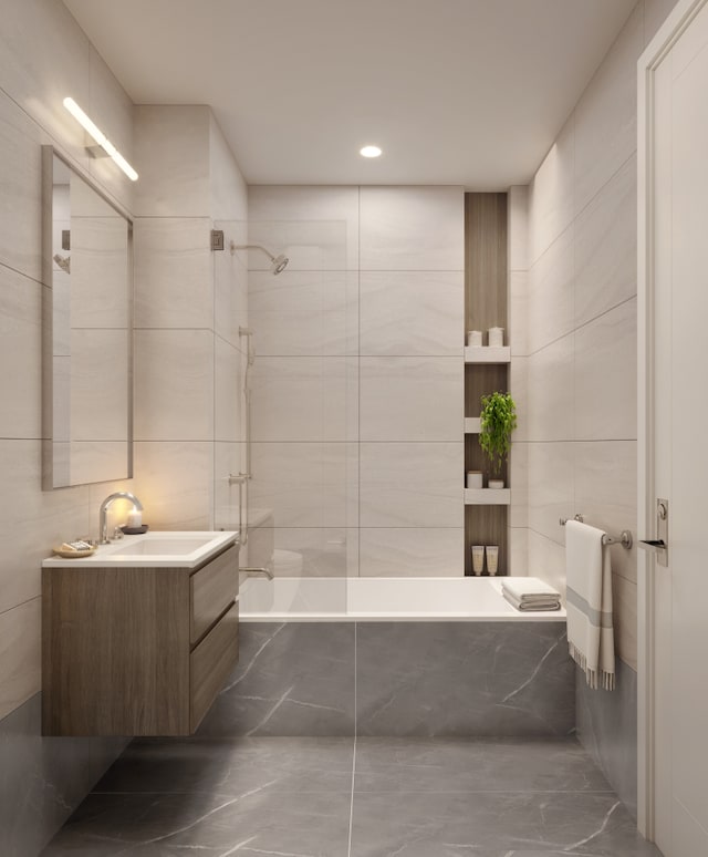 65 Eckford St Unit 2C, New York City, NY 11222 - full bathroom featuring tile walls, vanity, marble finish floors, and recessed lighting