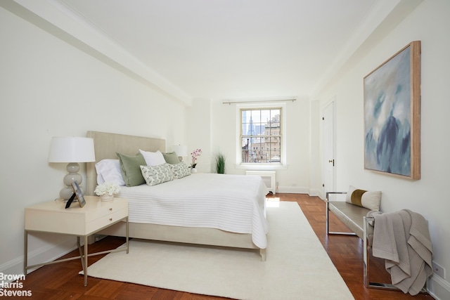 bedroom featuring radiator heating unit and baseboards