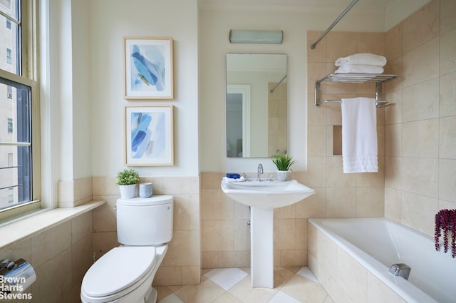 full bathroom featuring toilet and tile walls