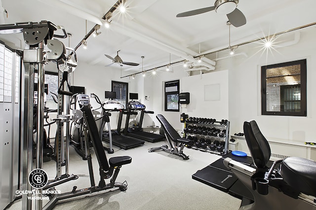 exercise room with a ceiling fan