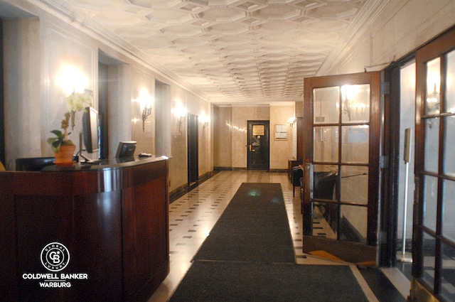 welcome area featuring crown molding