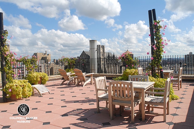 view of patio / terrace featuring fence and outdoor dining space