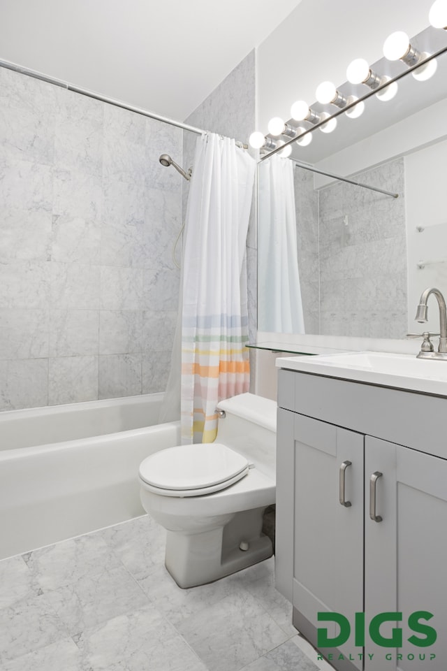 full bath with vanity, marble finish floor, toilet, and shower / tub combo