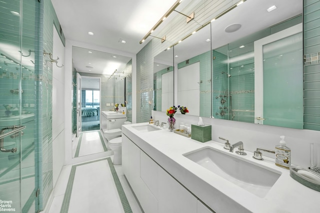 200 E 69th St Unit 42A, New York City, NY 10021 - ensuite bathroom featuring toilet, a shower stall, double vanity, tile patterned floors, and recessed lighting
