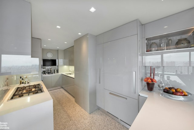 200 E 69th St Unit 42A, New York City, NY 10021 - kitchen with modern cabinets, stainless steel gas cooktop, and light countertops