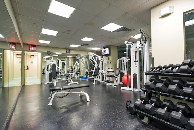 gym with visible vents and a drop ceiling