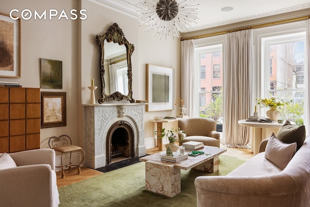 130 Fort Greene Place, New York City, NY 11217 - living room featuring a fireplace with flush hearth, healthy amount of natural light, wood finished floors, a chandelier, and ornamental molding
