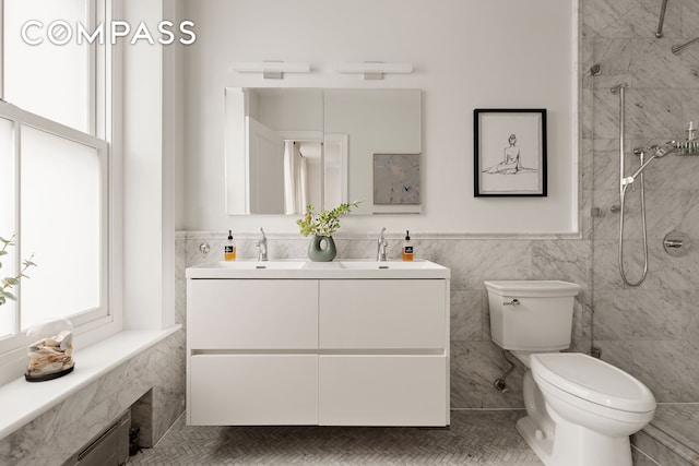 130 Fort Greene Place, New York City, NY 11217 - bathroom featuring plenty of natural light, toilet, tiled shower, tile walls, and double vanity