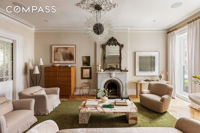 130 Fort Greene Place, New York City, NY 11217 - living area featuring plenty of natural light, ornamental molding, a chandelier, a fireplace, and baseboards