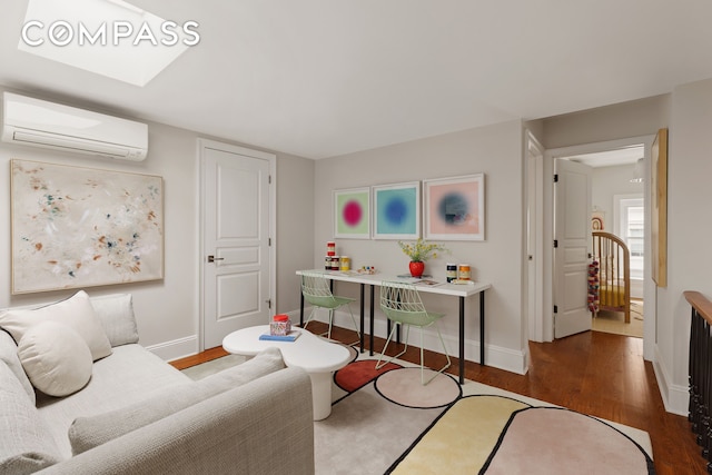 130 Fort Greene Place, New York City, NY 11217 - living area featuring an AC wall unit, wood finished floors, and baseboards