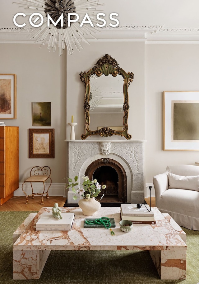130 Fort Greene Place, New York City, NY 11217 - living room featuring crown molding, a chandelier, baseboards, and a premium fireplace
