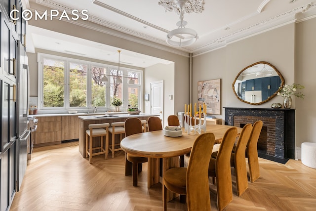 130 Fort Greene Place, New York City, NY 11217 - dining room with ornamental molding, a chandelier, and a fireplace