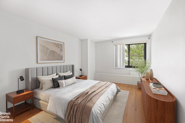 90 Gold St Unit 3E, New York City, NY 10038 - bedroom with wood finished floors