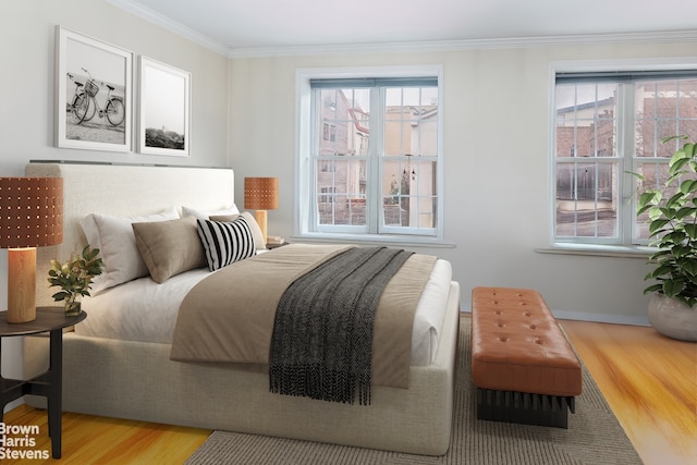 bedroom with crown molding, baseboards, multiple windows, and wood finished floors