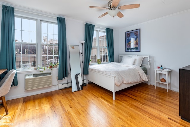 bedroom with crown molding, a baseboard radiator, light wood-style floors, and an AC wall unit