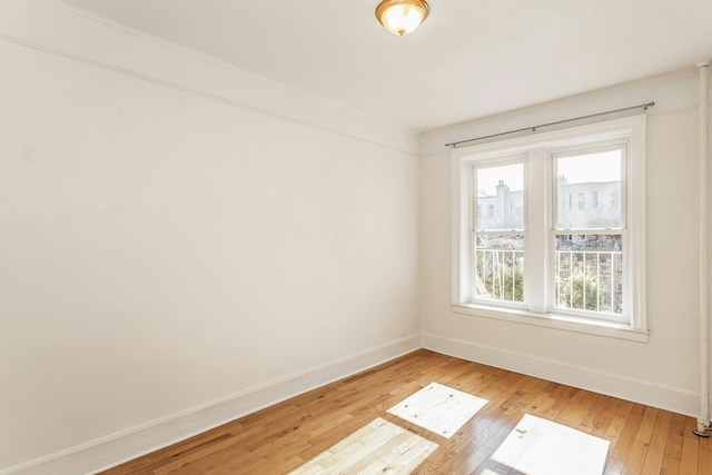 561 41st St Unit 2C, New York City, NY 11232 - empty room with baseboards and light wood finished floors