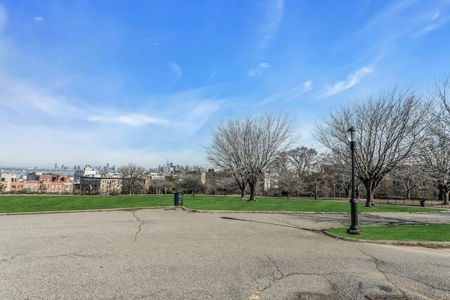 561 41st St Unit 2C, New York City, NY 11232 - view of asphalt road featuring curbs, street lights, and a view of city