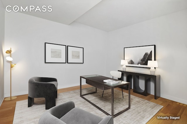 75 Wall St Unit 36F, New York City, NY 10005 - home office with baseboards and wood finished floors