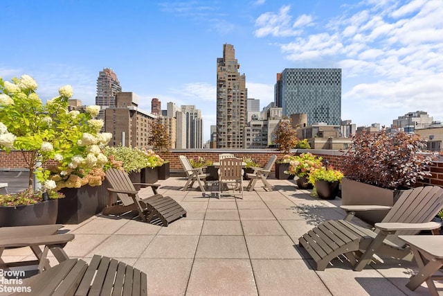 310 E 70th St Unit 4Lm, New York City, NY 10021 - view of patio / terrace featuring a skyline view and outdoor dining area