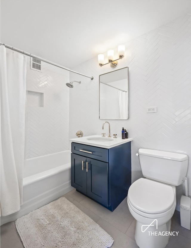 10 W 15th St Unit 1523, New York City, NY 10011 - full bath featuring toilet, vanity, tile patterned floors, and shower / bath combo with shower curtain