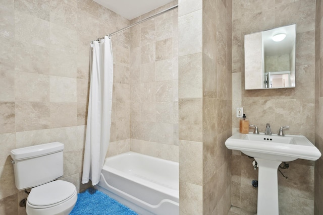 bathroom featuring toilet, tile walls, and shower / bathtub combination with curtain