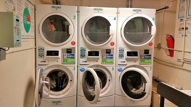 common laundry area with independent washer and dryer and stacked washer and clothes dryer