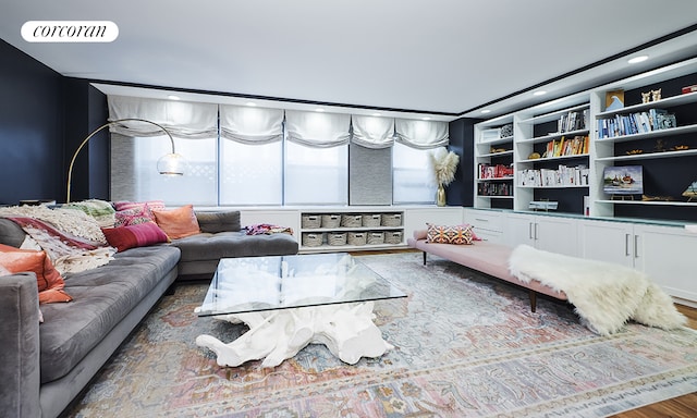 living area featuring wood finished floors and visible vents