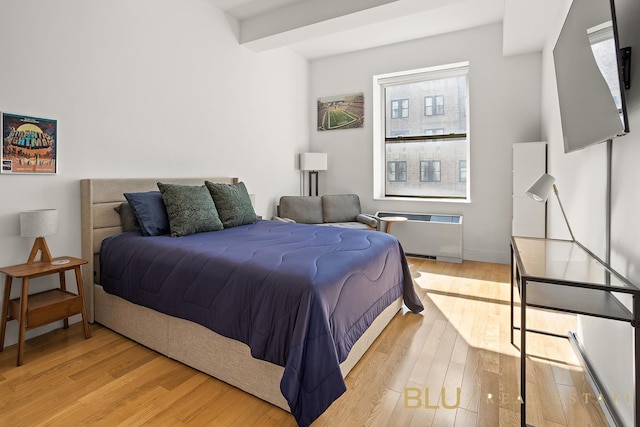 99 John St Unit 2006, New York City, NY 10038 - bedroom featuring radiator and light wood-style floors