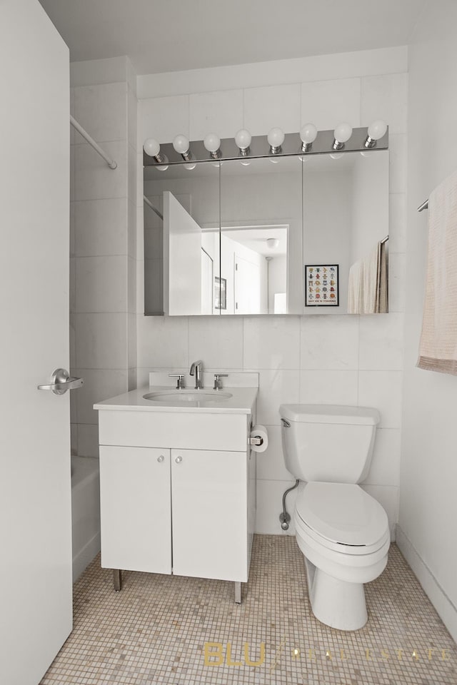 99 John St Unit 2006, New York City, NY 10038 - full bath featuring vanity, bathtub / shower combination, tile walls, and tile patterned floors