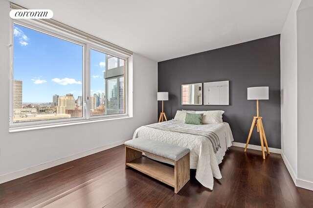 306 Gold St Unit 25D, New York City, NY 11201 - kitchen with appliances with stainless steel finishes, a sink, dark countertops, a peninsula, and dark wood-style floors