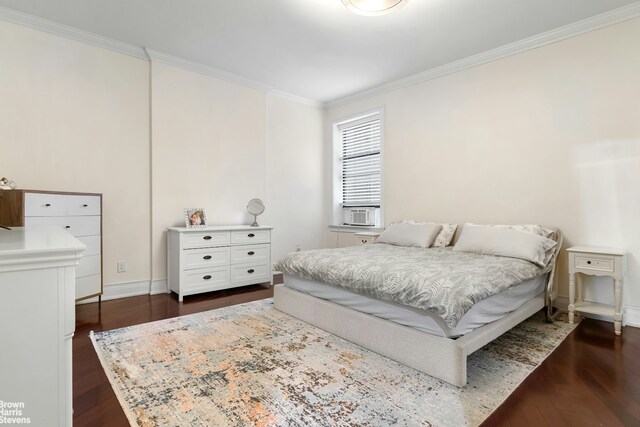 229 W 97th St Unit 6E, New York City, NY 10025 - bedroom featuring cooling unit, baseboards, dark wood finished floors, and crown molding