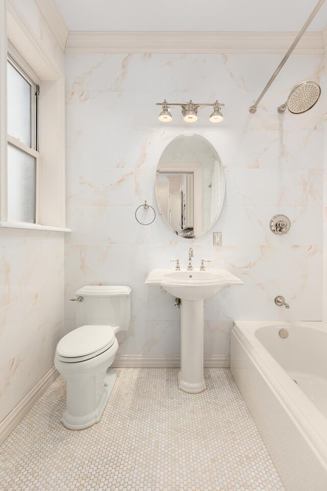 140 W 69th St Unit 107C, New York City, NY 10023 - bathroom with toilet, shower / bath combination, ornamental molding, tile walls, and a sink