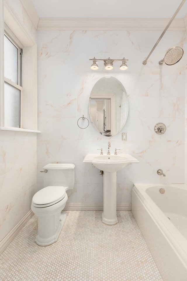 bathroom featuring toilet,  shower combination, ornamental molding, and tile walls